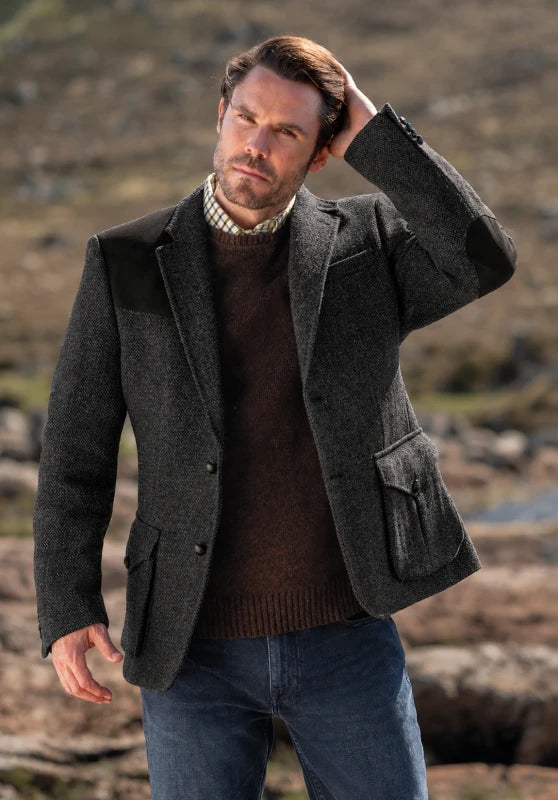 Men's tweed blazer, dark grey textured tweed slim-fit close-up fabric and pocket detail