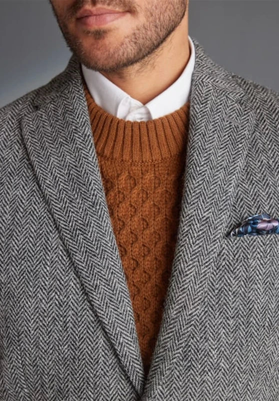 Men's herringbone tweed blazer, black wool-blend fabric slim-fit close-up fabric and pocket detail